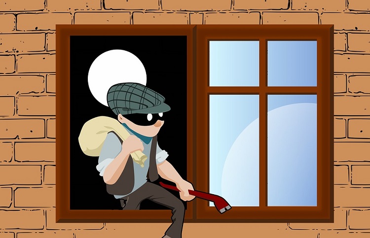 Man busted breaking into garage